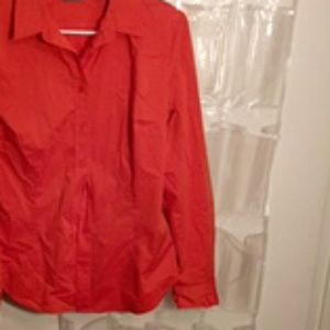 Orange button down shirt with pleat in the back